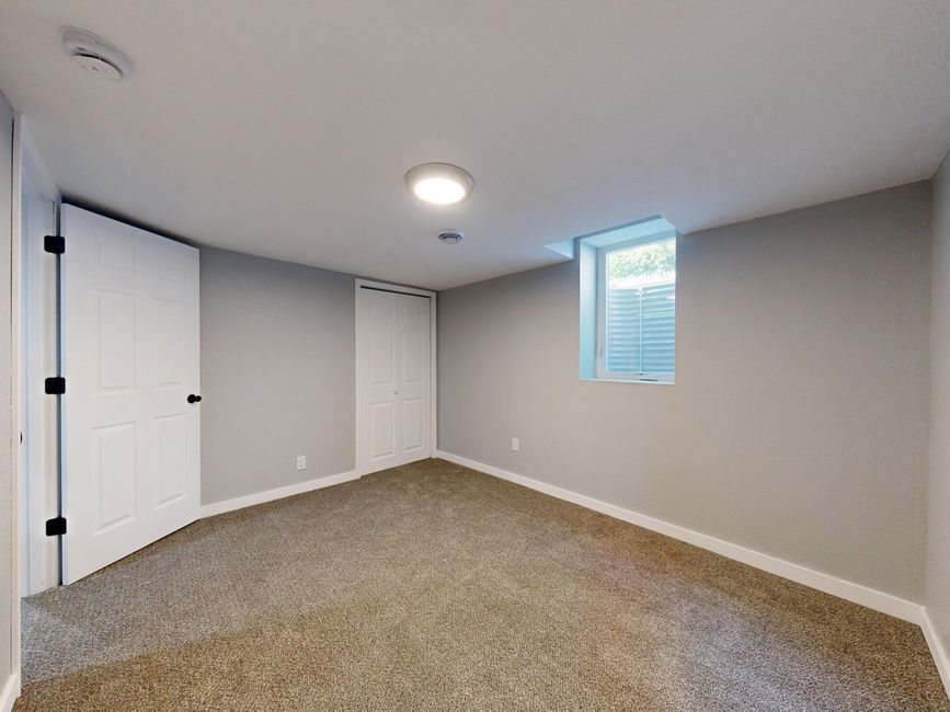 Small existing basement window next to the larger opening size egress code requires