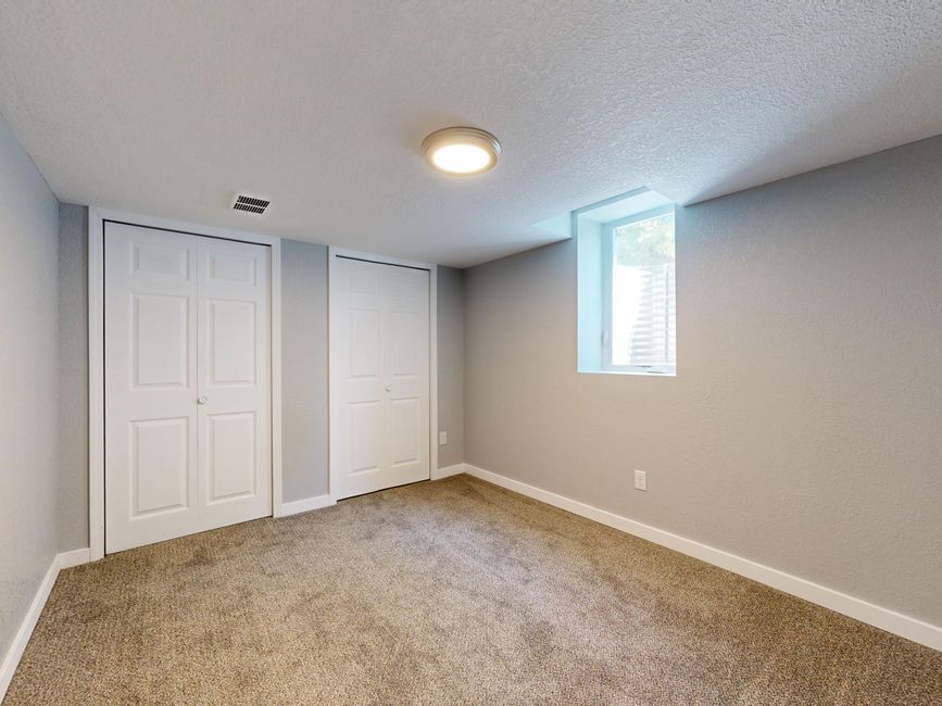 Basement bedroom window that appears too small to meet egress code requirements