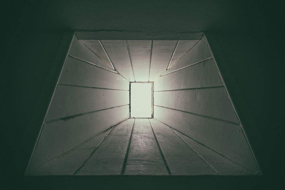 A below-grade basement window installed inside a window well